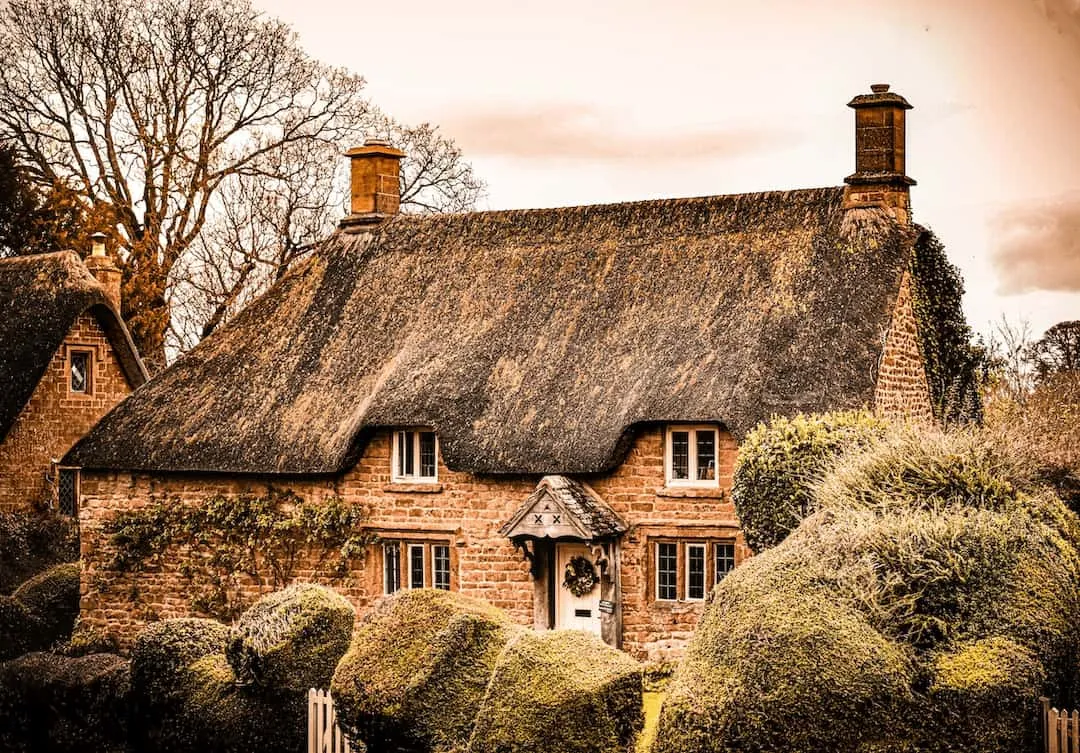 A cozy cottage with a thatch roof